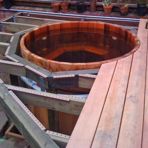 Wooden hot tub with wooden deck framing
