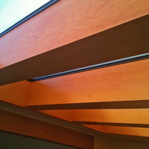 Close up of four heavy beams and skylight