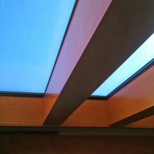 Close up of heavy dark stained wood beams and skylight